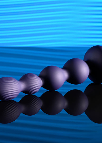 Evolved PLEASURE ORBIT - Navy Blue 17.8 cm USB Rechargeable Twirling & Vibrating Anal Beads with Remote