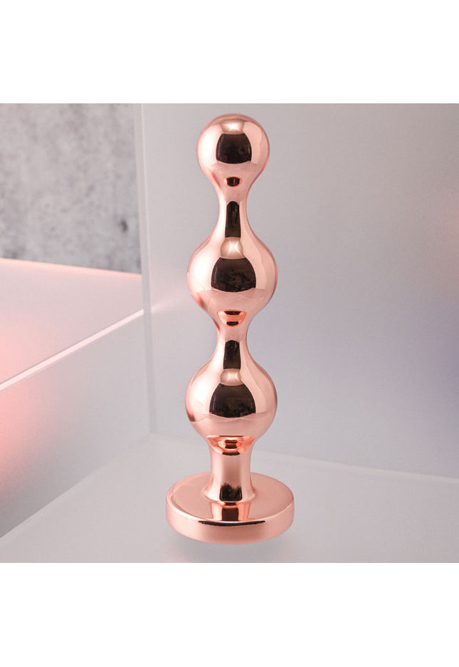 Gender X GOLD DIGGER Large - Rose Gold Large Butt Plug with Black Gem Base